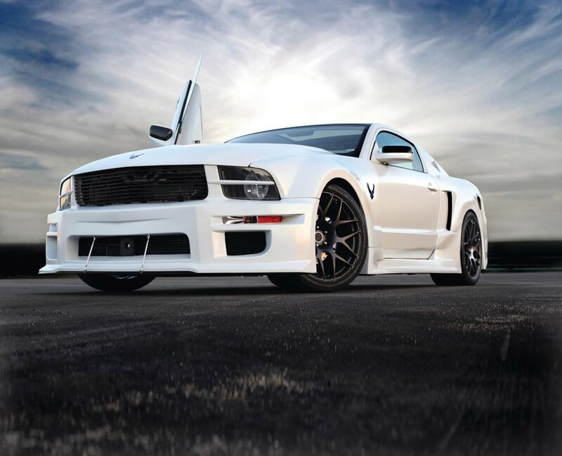 white ford mustang with gullwing door