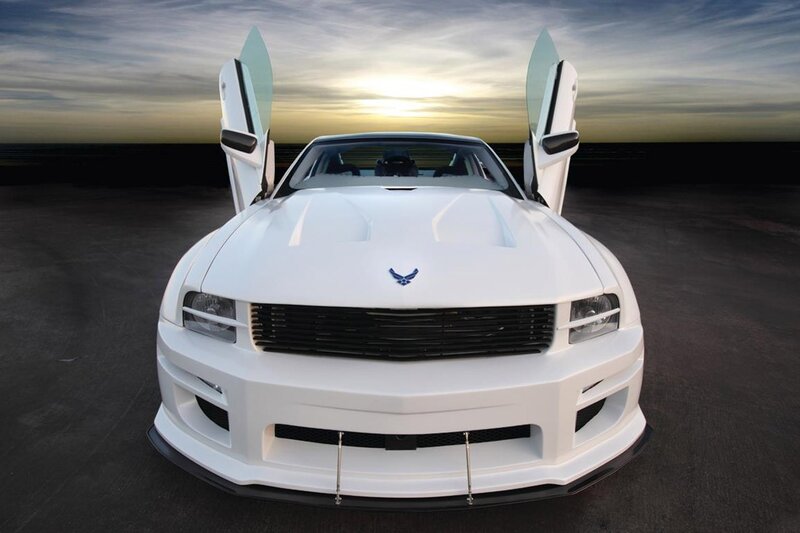 White Ford Mustang with open doors