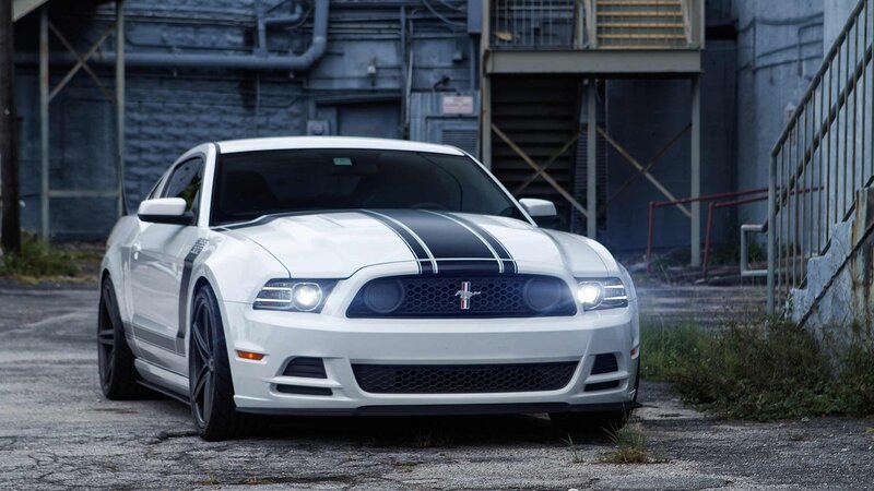 white ford mustang with racing stripes