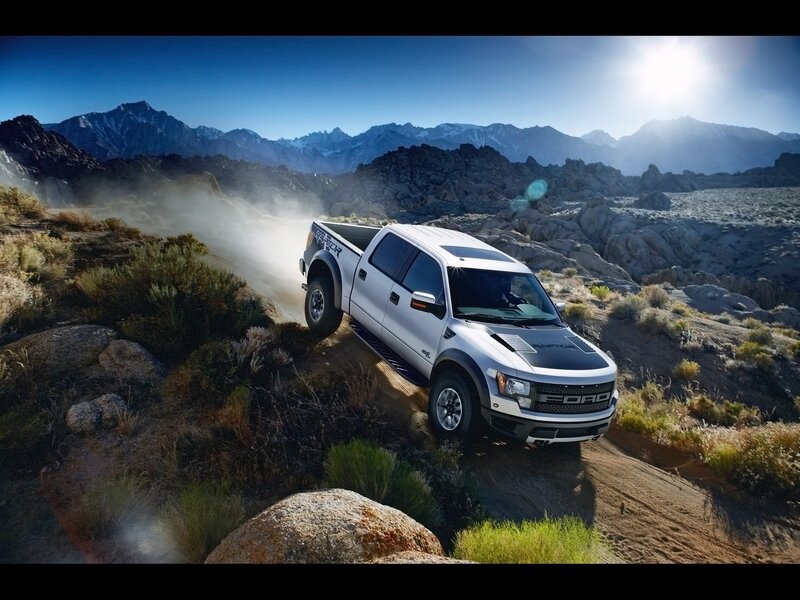 White Ford Raptor off-roading