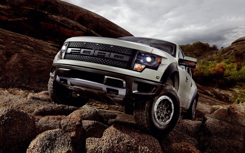 White Ford Raptor on rocky terrain