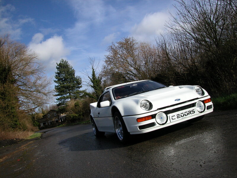 White Ford RS200 on a wet road