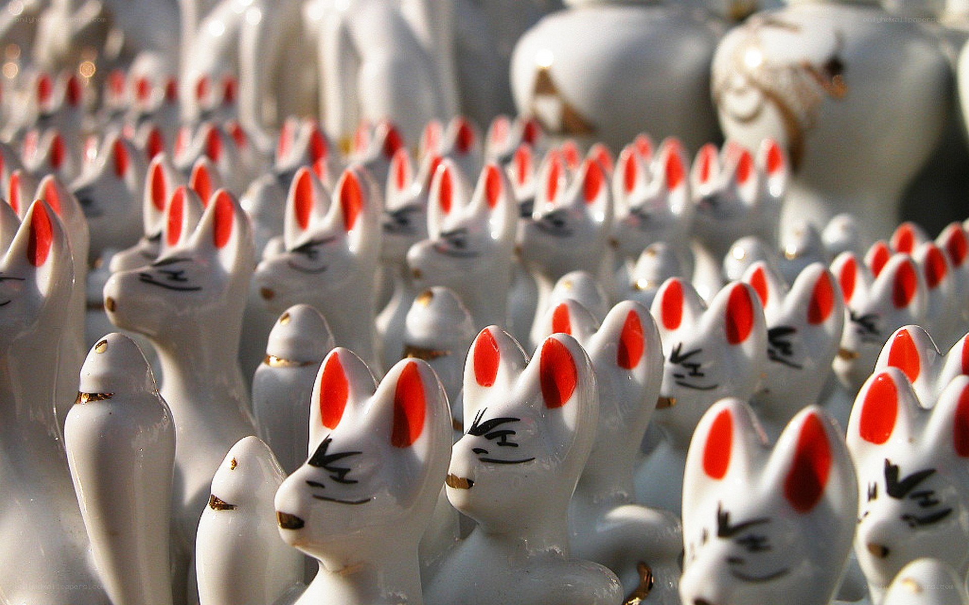White fox figurines in rows