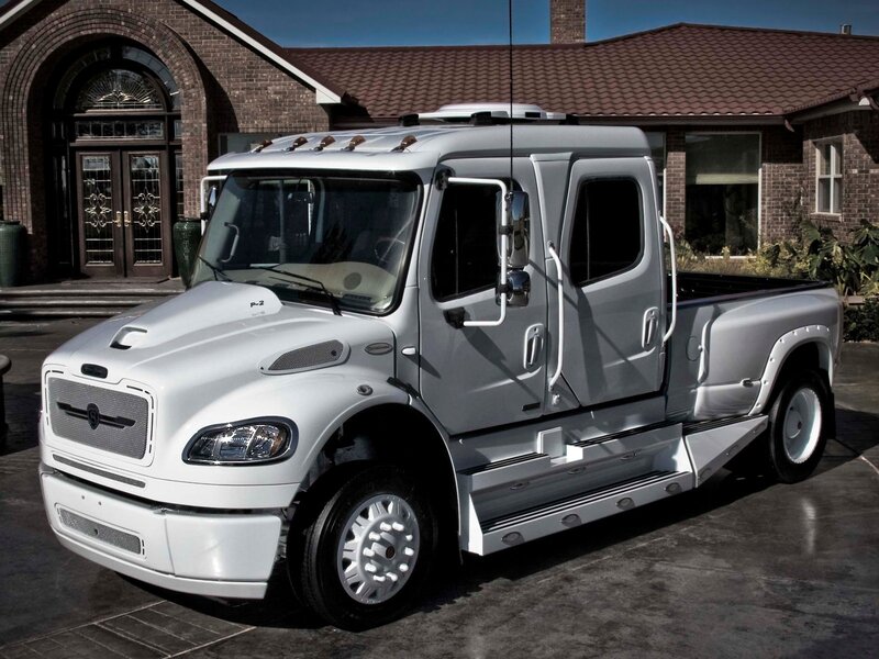 White Freightliner truck in driveway