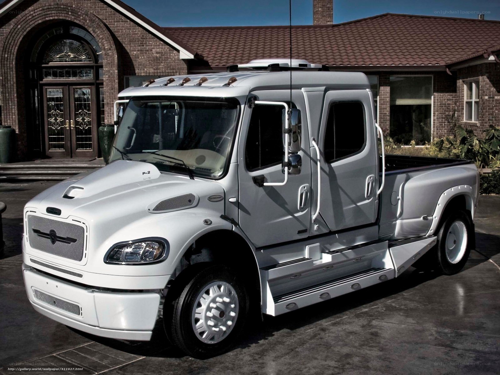 White Freightliner truck parked