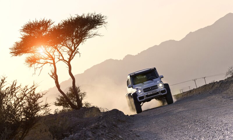 White G-wagon on Dirt Road