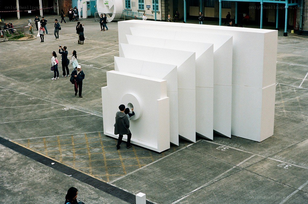 White geometric sculpture in courtyard