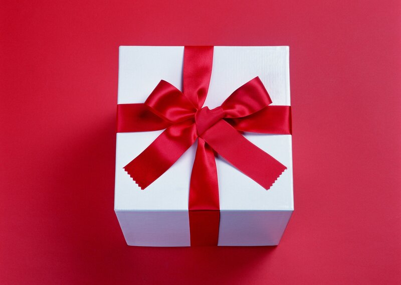 white gift box with red bow