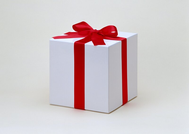 white gift box with red ribbon