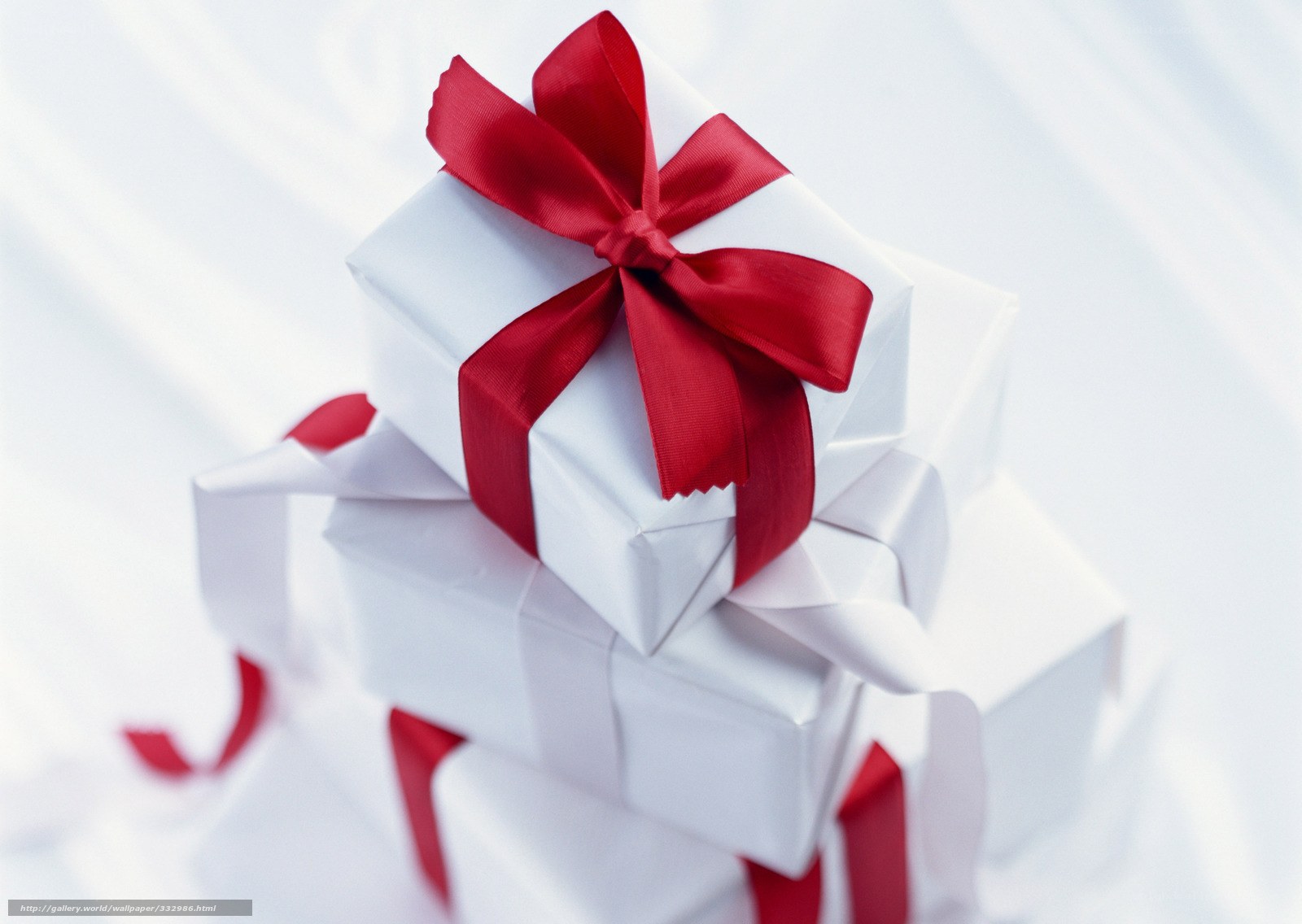 White gifts with red ribbons