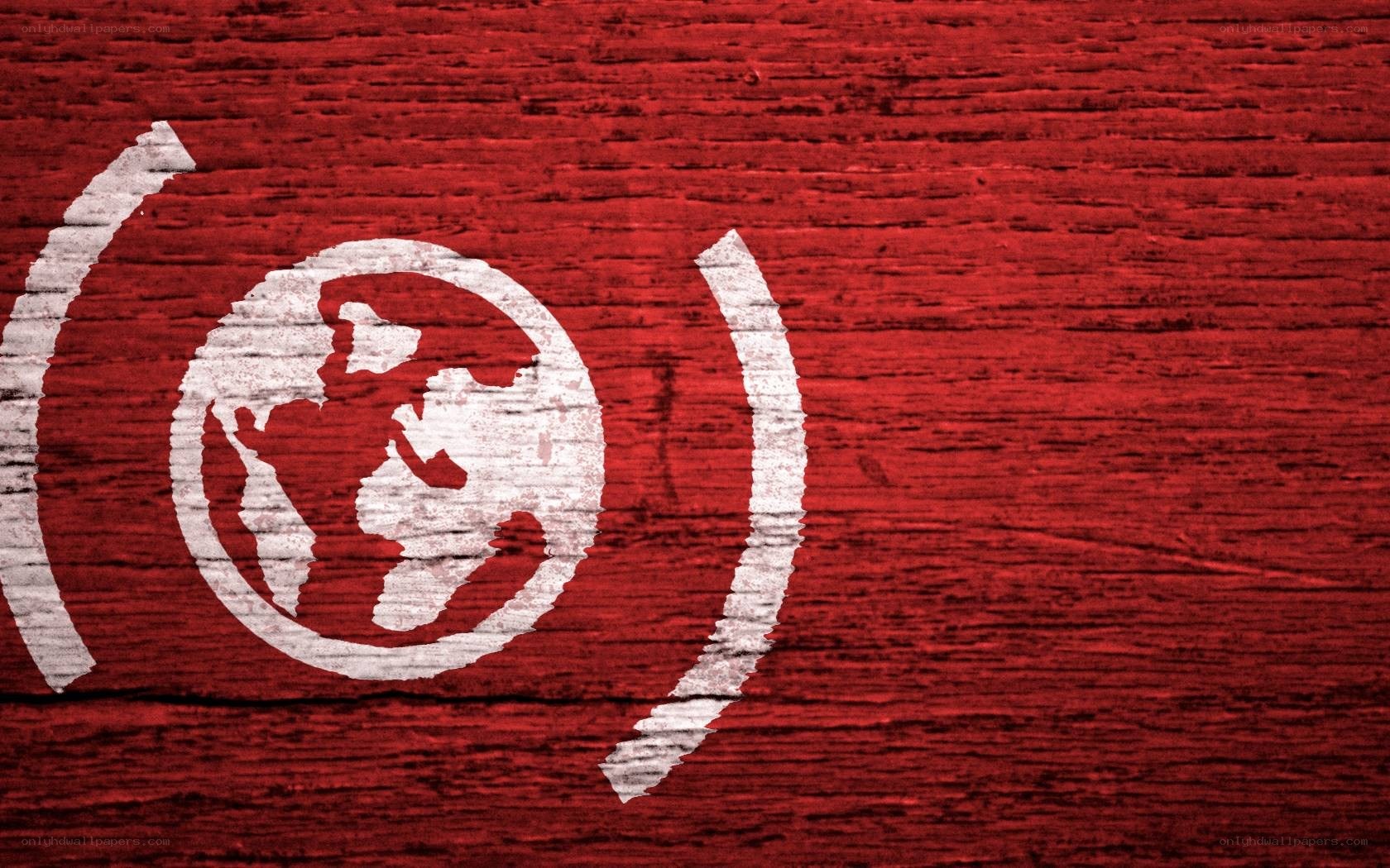 white globe logo on red wood