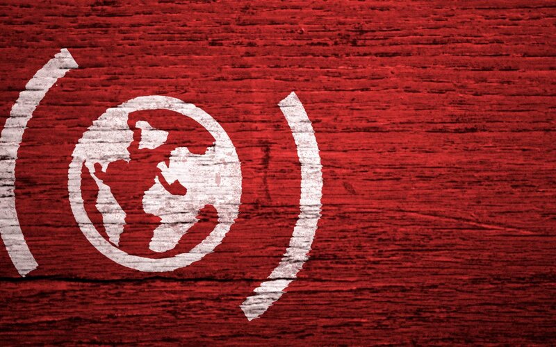 white globe symbol on red wood