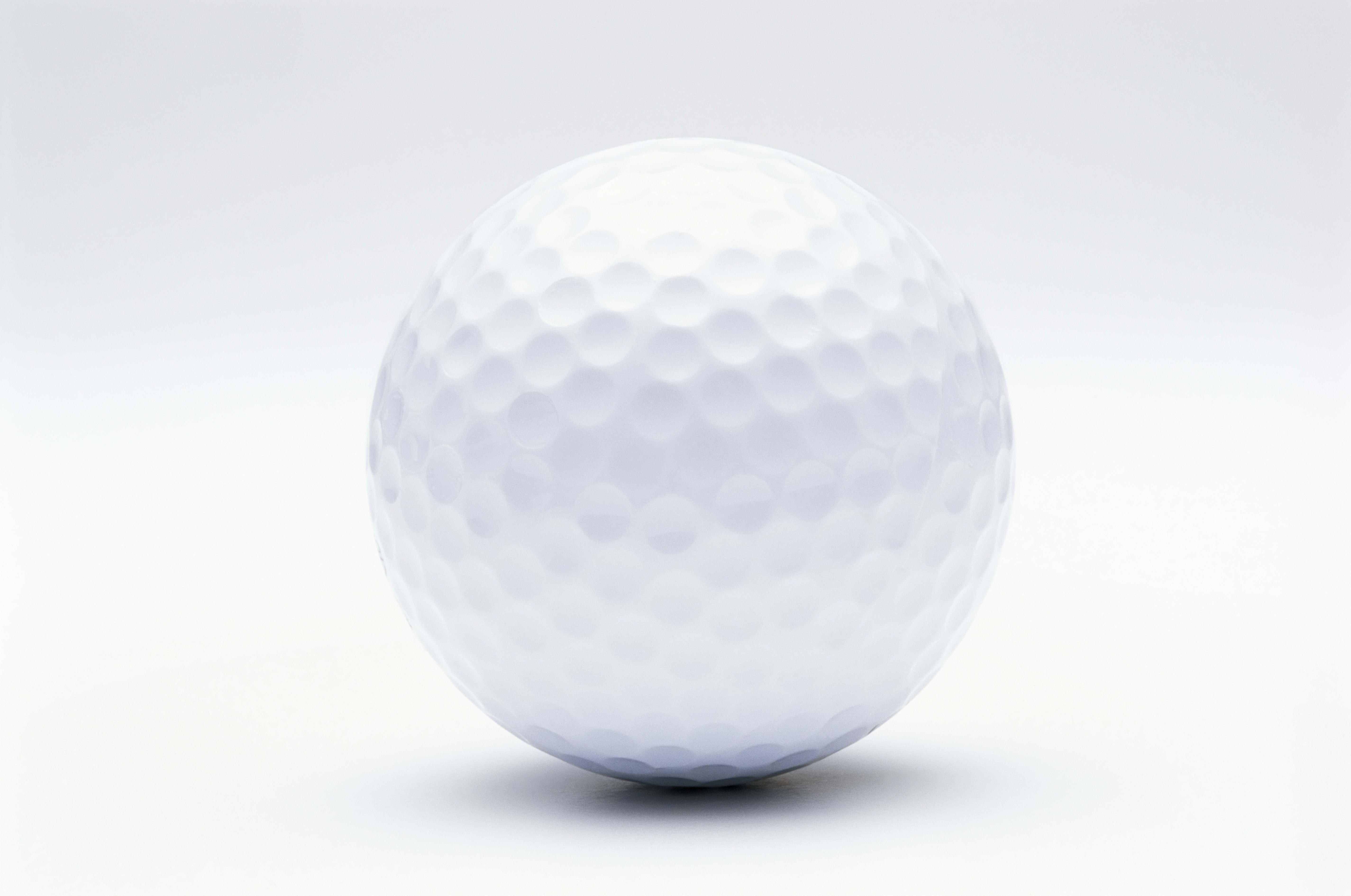 white golf ball on white background