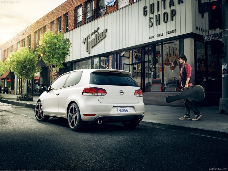 White Golf GTI on city street