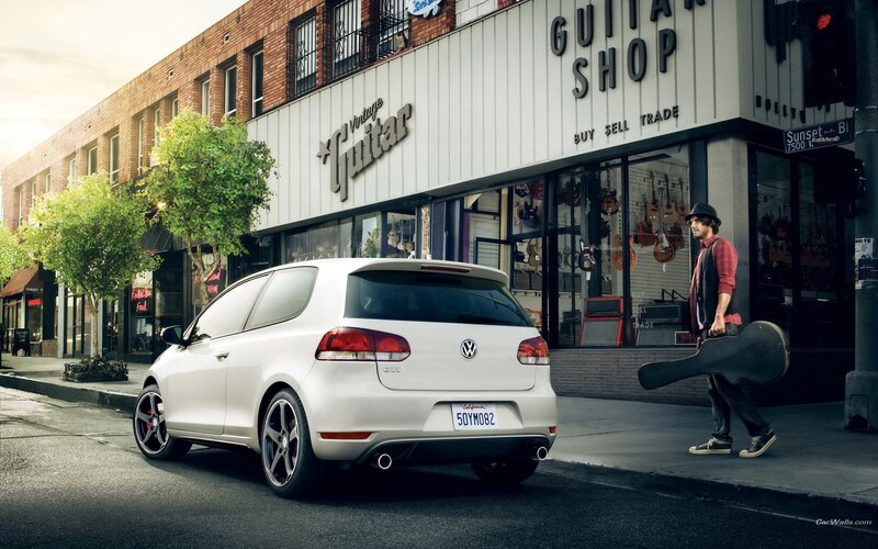 White Golf GTI on city street