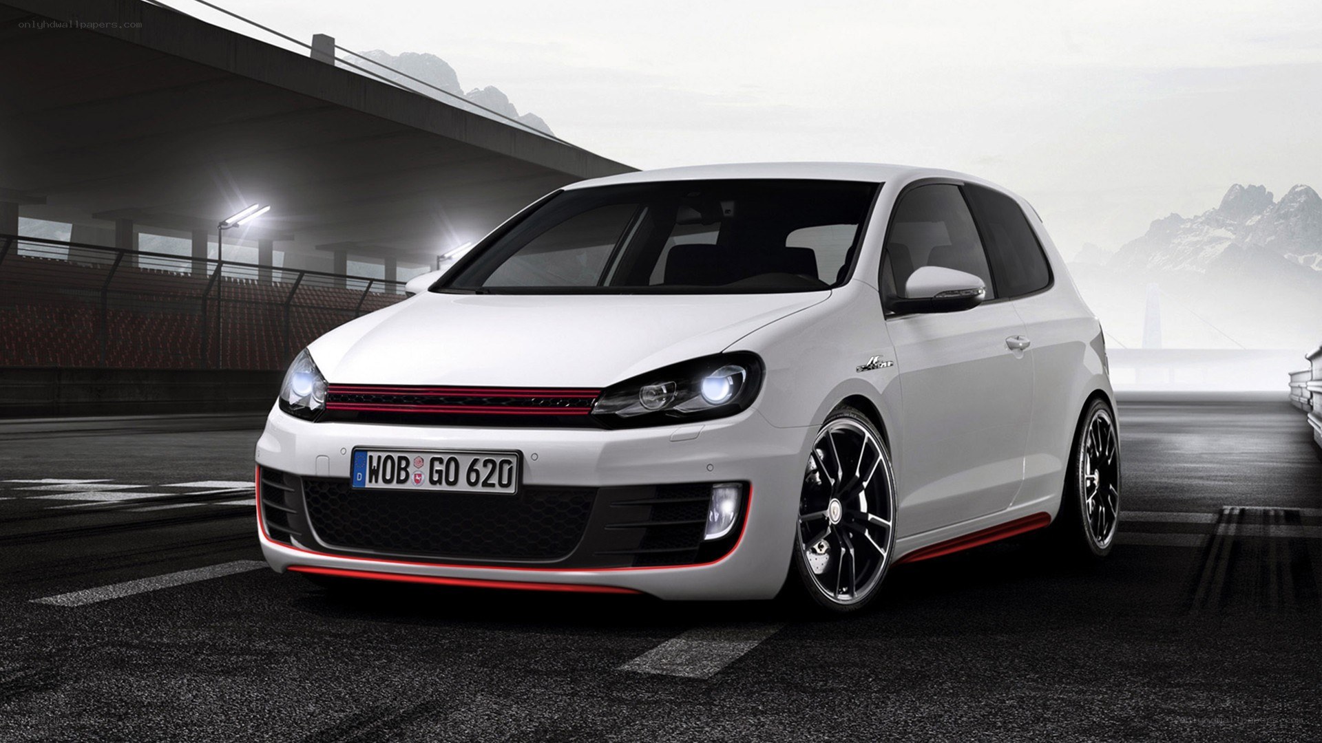 white golf hatchback on racetrack