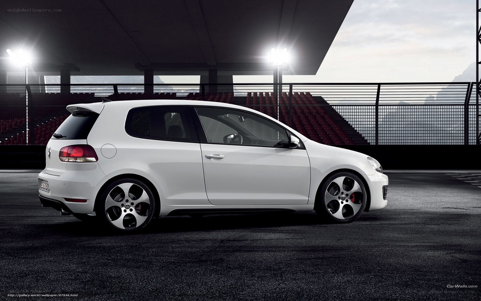 white golf hatchback on track