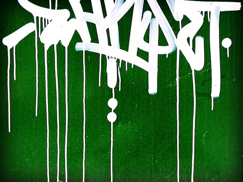 White Graffiti on Green Wall — Urban
