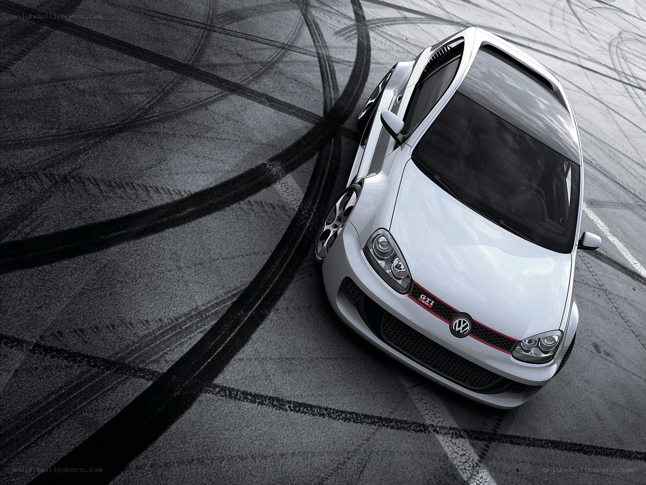 White GTI on racetrack
