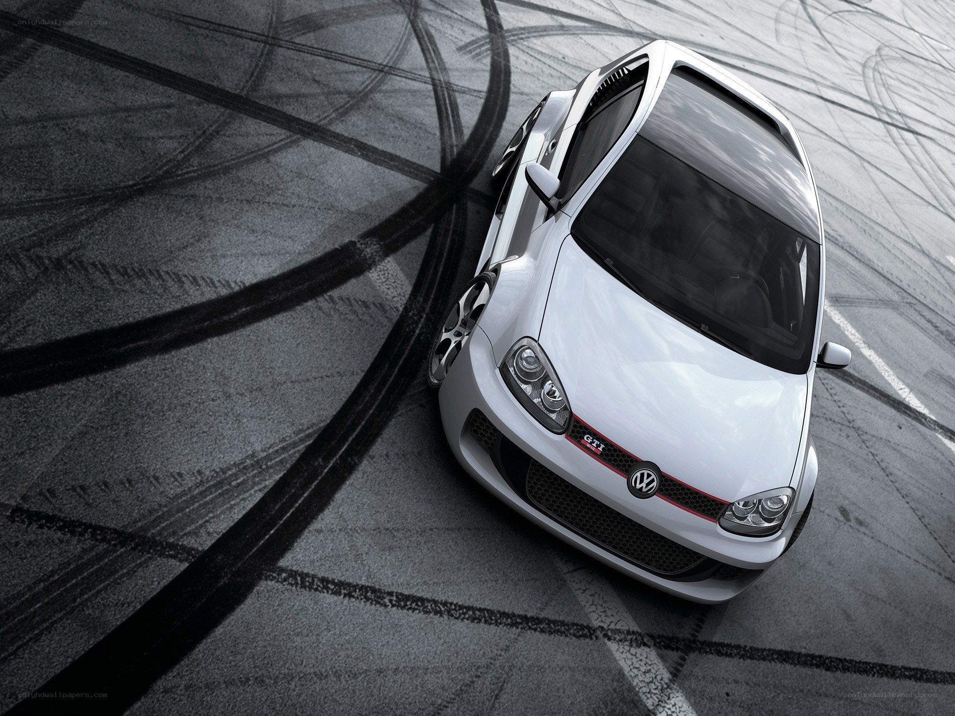 White GTI on racetrack