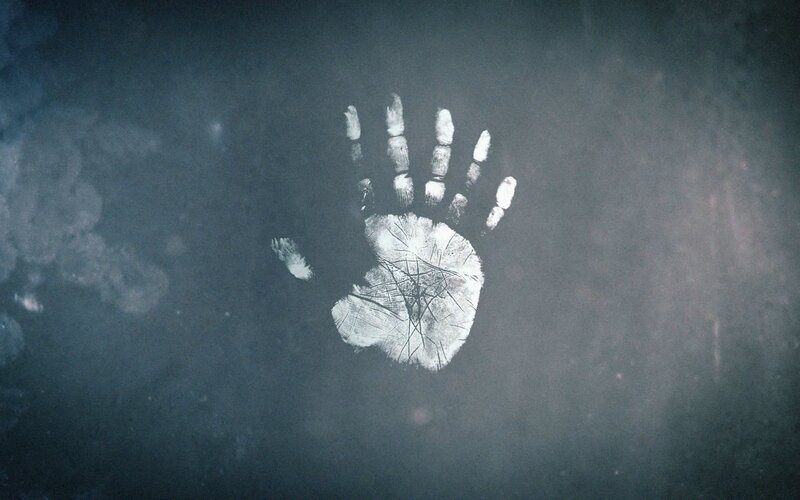 White Handprint on Dark Surface — Gray, Dramatic