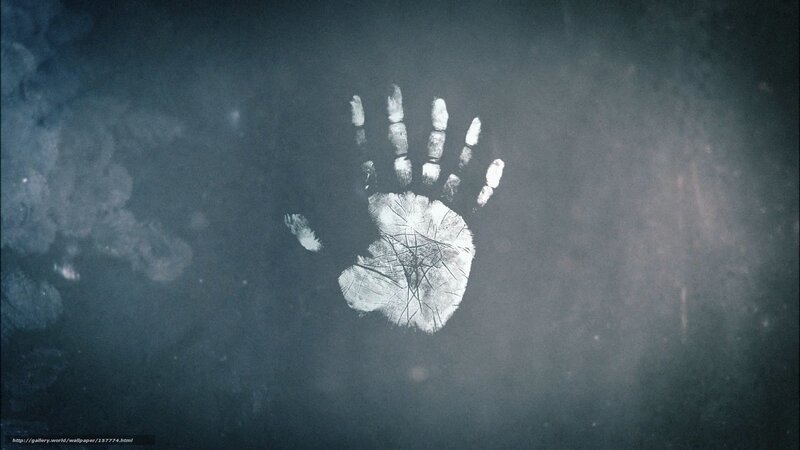 white handprint on dark surface