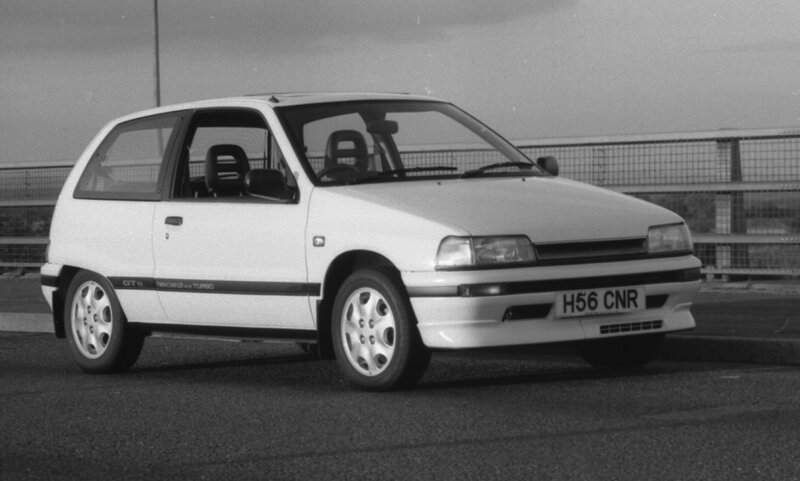 White Hatchback Car — Black