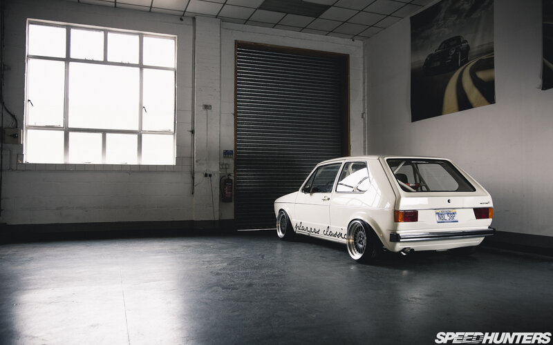 White Hatchback Car — Dramatic, Photograph, Garage
