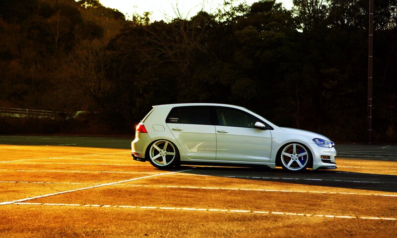 White Hatchback Car — Dramatic, Sunset