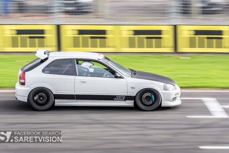 White Hatchback Car — Dynamic, Afternoon, Photograph