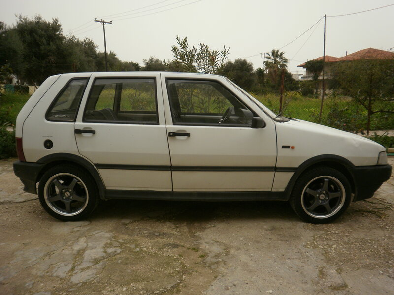 White Hatchback Car — Overcast, Photograph