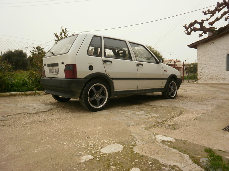 White Hatchback Car — Overcast
