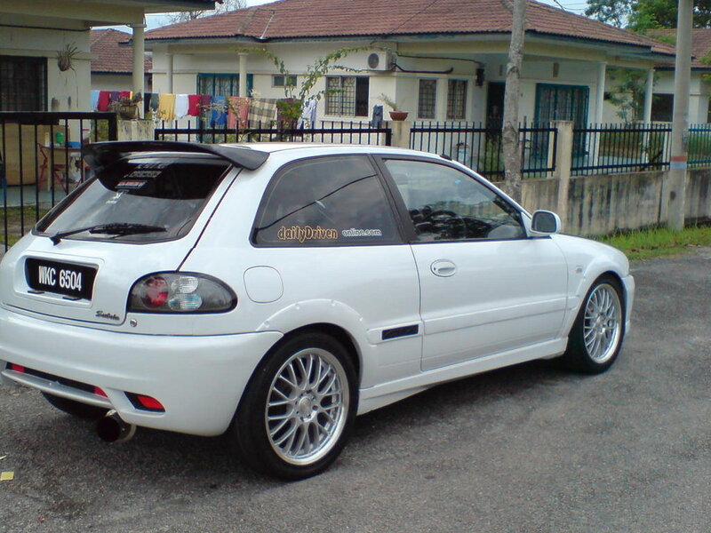white hatchback car parked