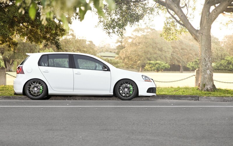 White Hatchback Car — Serene, Afternoon, Photograph