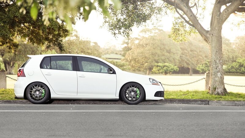 White Hatchback Car — Serene, Afternoon, Photograph, Tree, Grass