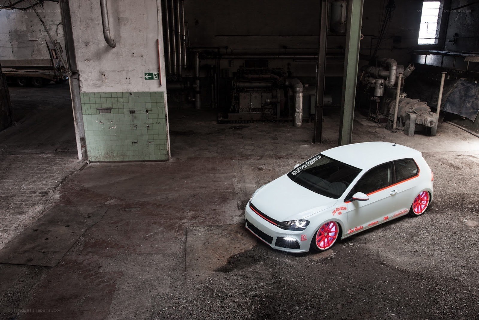 White hatchback in industrial space