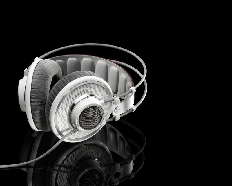 white headphones on black background