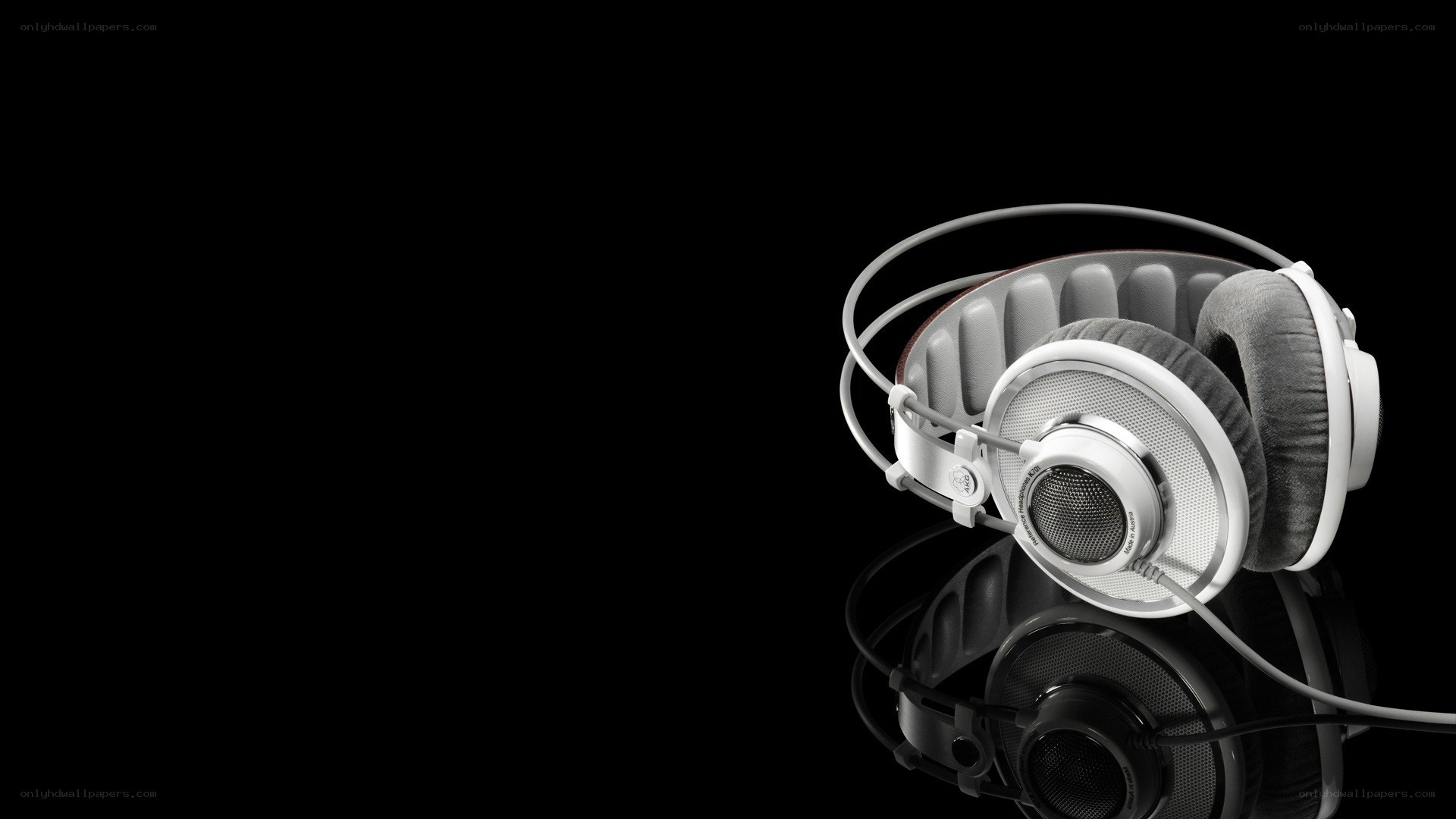 white headphones on black background