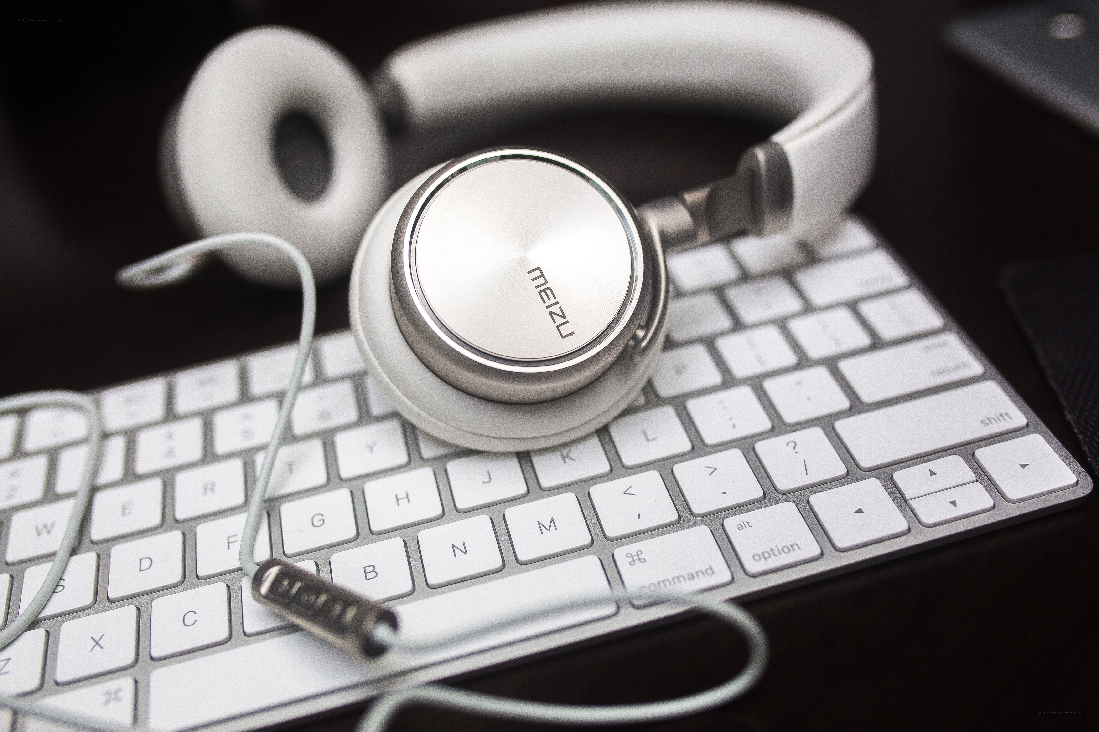 white headphones on keyboard