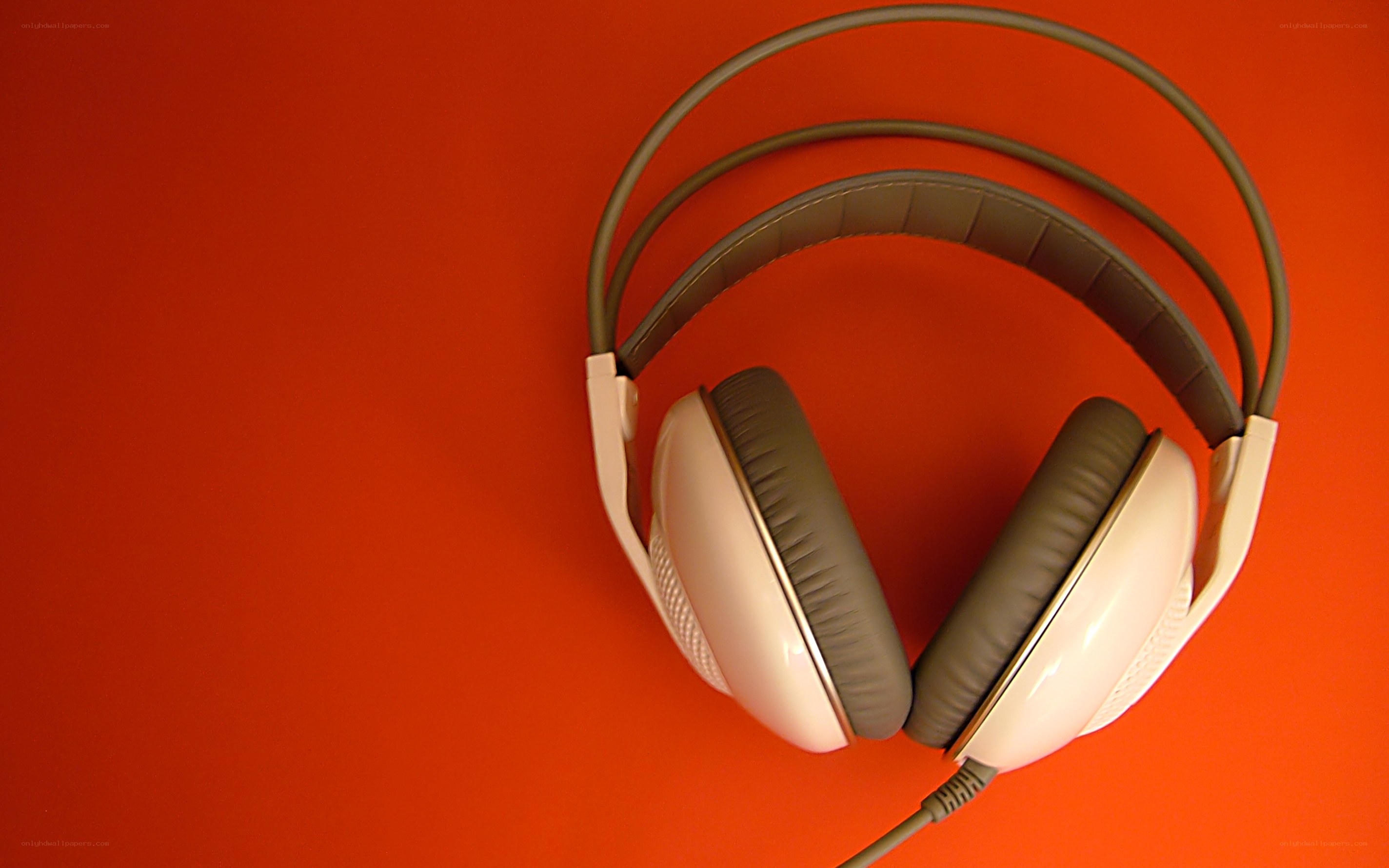 white headphones on red