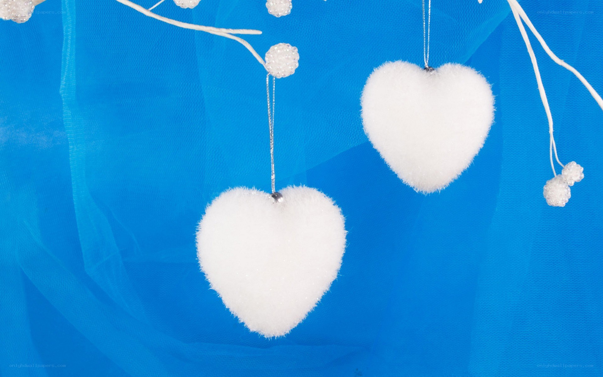 white heart ornaments on blue
