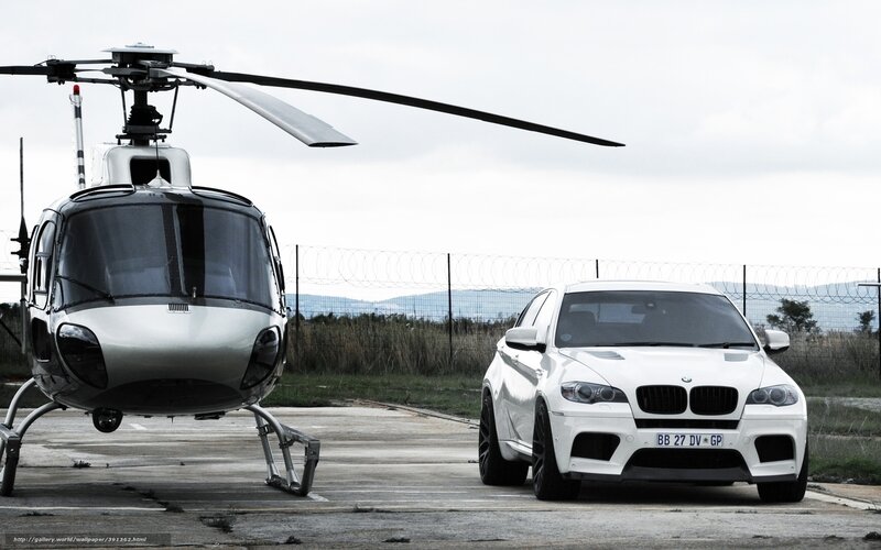White helicopter and car