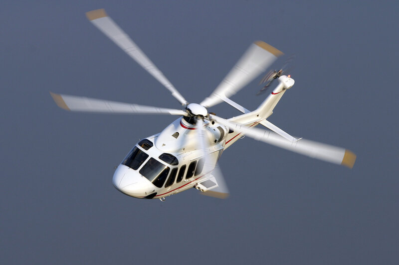 White helicopter in flight