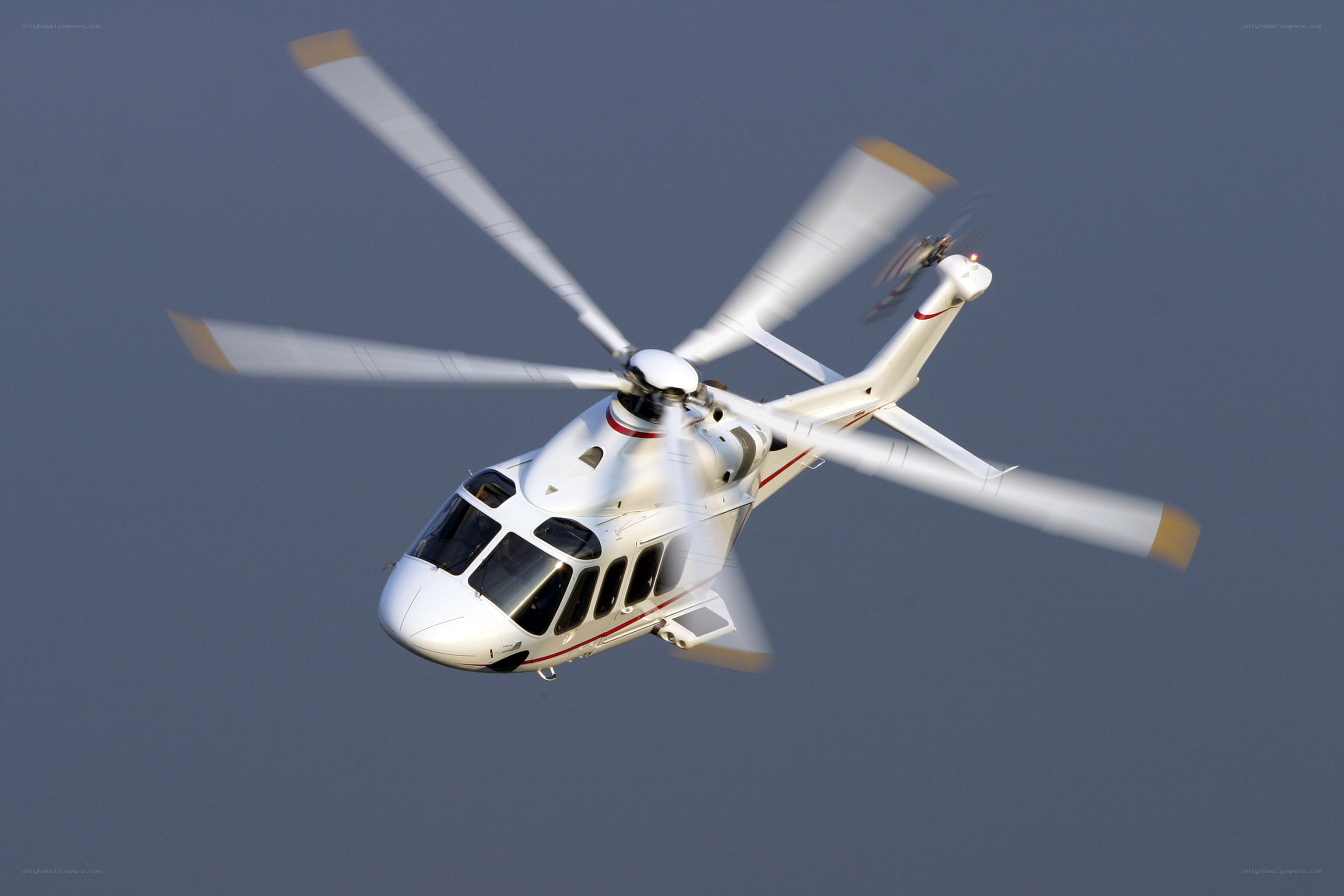 White helicopter in flight