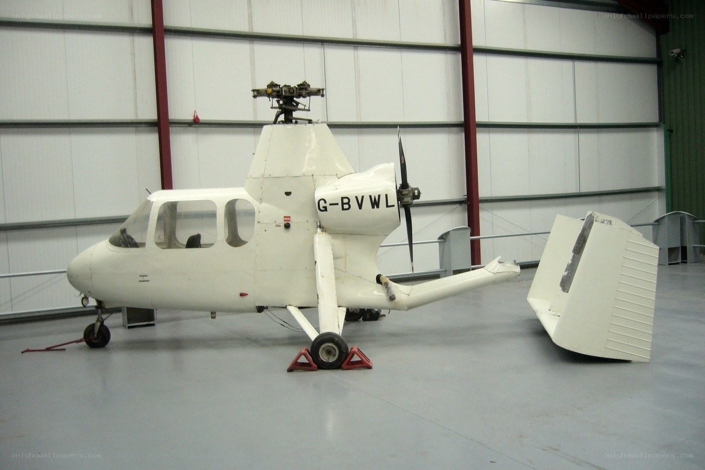 White helicopter in hangar