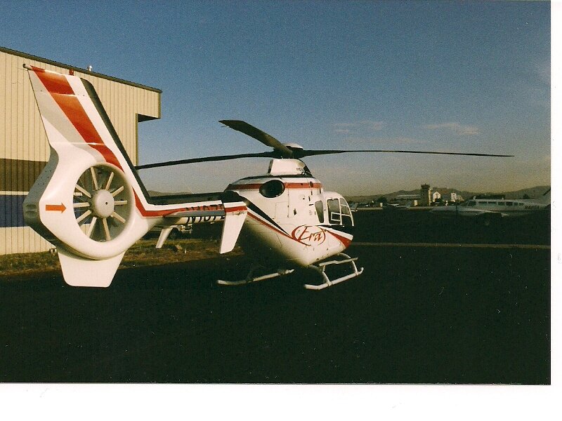 White Helicopter on Tarmac — Calm