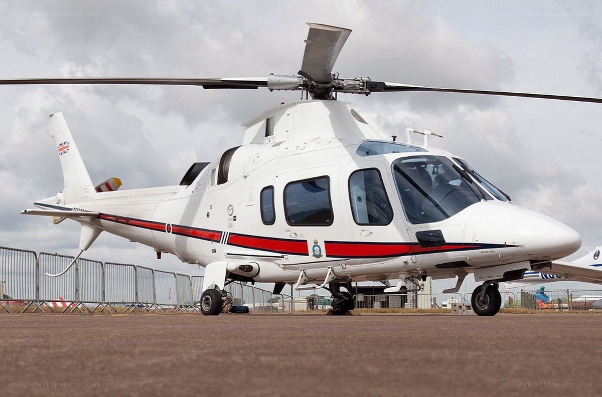white helicopter on tarmac