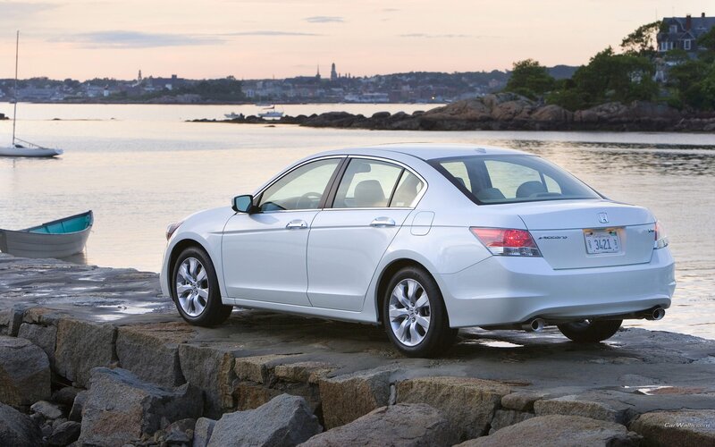 White Honda Accord by the water