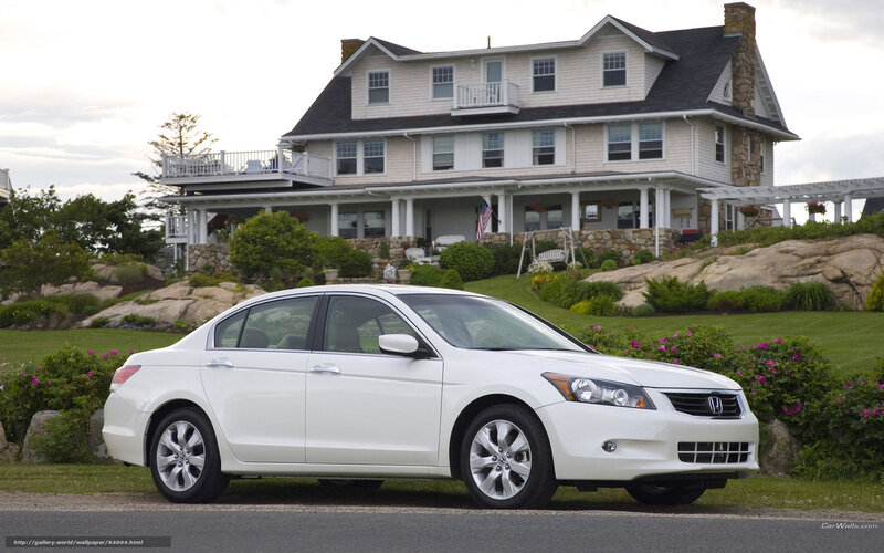 White Honda Accord in front of a house