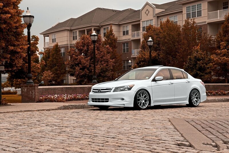 White Honda Accord on cobblestone street